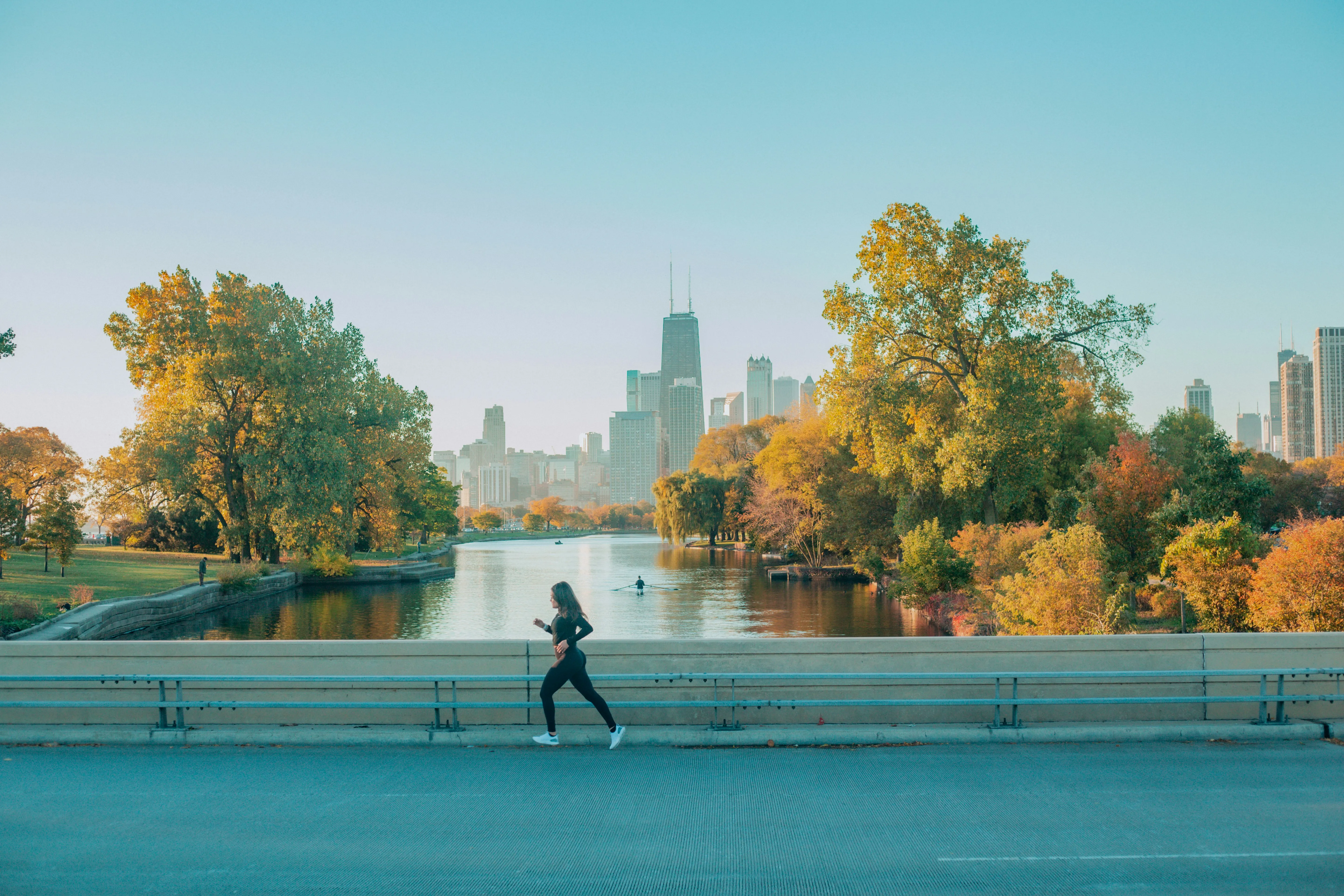 A running with the Chicago skyline in the background